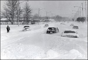 Cars are stranded on Heatherdowns Boulevard on Jan. 27, 1978, after the big blizzard. Some drifts measured up to 15 feet.