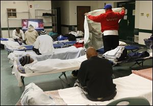 Homeless men occupy cots for the night at St. Paul's Community Center in Toledo, Ohio.
