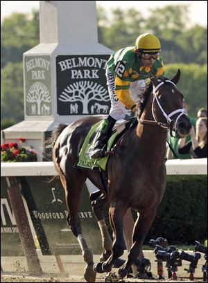 Palace Malice, ridden by jockey Mike Smith, wins the 145th Belmont Stakes horse race at Belmont Park on June 8, 2013, in Elmont, N.Y.