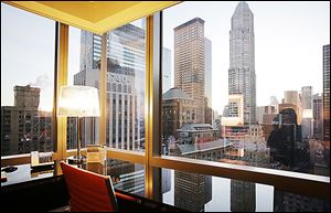 A room on the 30th floor of the Courtyard-Residence Inn Central Park, overlooks midtown Manhattan, Wednesday in New York.