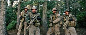 From left, Taylor Kitsch, as Michael Murphy, Mark Wahlberg as Marcus Luttrell, Ben Foster as Matt Axe Axelson, and Emile Hirsch as Danny Dietz in a scene from the film, Lone Survivor.