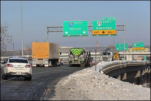 Traffic backs up on northbound I-75 south of downtown Toledo shortly after noon Thursday after an accident involving a semi. Most of the city’s main routes were clear, probably aided by Ohio’s authority to declare weather emergencies.