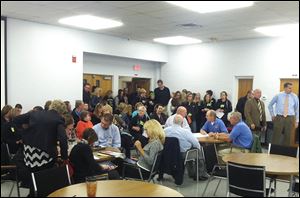 About a third of Perrysburg teachers signed up for performance-based pay, permitted under the new labor contract which teachers shown here a few months ago were negotiating.