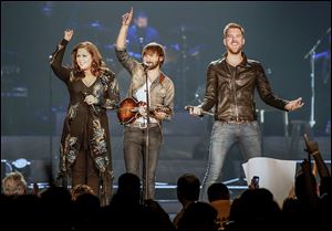 An enthusiastic Hillary Scott, Dave Haywood, and Charles Kelley entertain the sold-out Huntington Center as part of the second stop on the group’s Take Me Downtown tour.