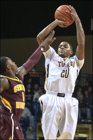 Toledo point guard Julius Brown shoots a 3-pointer against Central Michigan. Brown had 15 points and 12 assists.