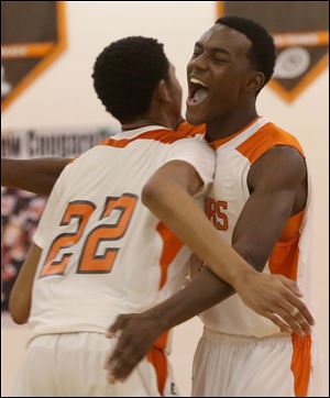Southview's JJ Pinckney, right, embraces his teammate junior Jeremiah Roberts (22) after a stunning upset win over Perrsburg at home.
