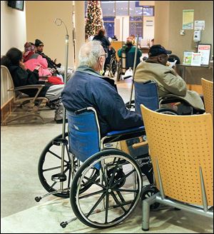 Patients wait to be treated at the ProMedica Toledo Hospital emergency room. Toledo area hospitals are focused on faster care and improving customer service.