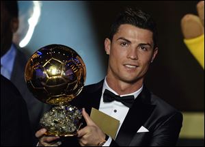 Cristiano Ronaldo of Portugal is awarded the prize for the FIFA Men's soccer player of the year 2013 at the FIFA Ballon d'Or 2013 gala Monday at the Kongresshaus in Zurich, Switzerland.