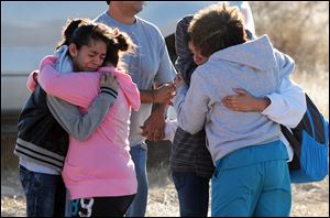 Students are reunited with family following a shooting at Berrendo Middle School, today, in Roswell, N.M.