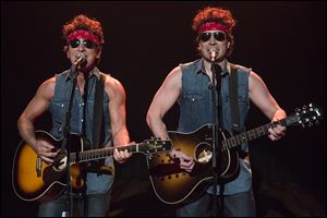 Bruce Springsteen, left, and Jimmy Fallon perform during 