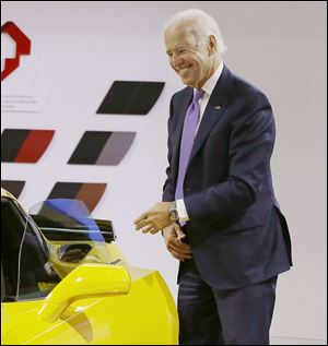Vice President Joe Biden smiles after exiting a Corvette Stingray during a tour of the North American International Auto in Detroit. Mr. Biden said Thursday the U.S. auto industry's resurgence since the 2009 federal bailout provides a strong basis for a Motor City recovery.