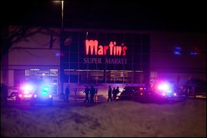Elkhart Police, the Elkhart Fire Department, Indiana State Police and emergency personnel respond to reports of a shooting inside Martin's Supermarket in Elkhart, Ind., about 10:30 p.m. Wednesday.