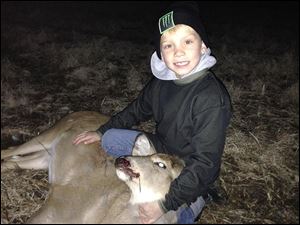 Owen Timbrook, 7, shot a white-tailed doe with a crossbow in Williams County.