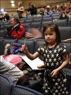 Jordan Patton, 4, of Findlay, after the ceremony. Her mom, Marilou Quirante Patton, originally from the Philippines, became a citizen in the ceremony. 