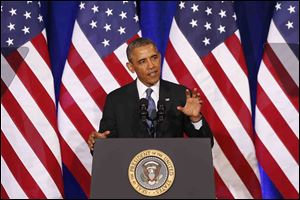 President Obama talks about National Security Agency surveillance, today, at the Justice Department in Washington. 