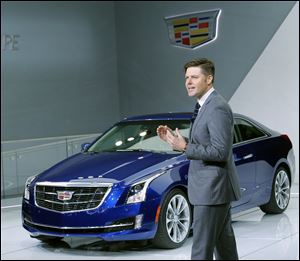 Andrew Smith, executive director of Global Cadillac design, speaks about the 2015 ATS Coupe, its concept car at the auto show.