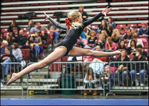 Toledo Turner gymnast Kylie Morgan performs. Kevin McKee, Ottawa Hills physical education teacher and local gymnastics coach, says the girls, who range in age from 5 to 18, get a taste for competition during events such as the Battle of Champions. 