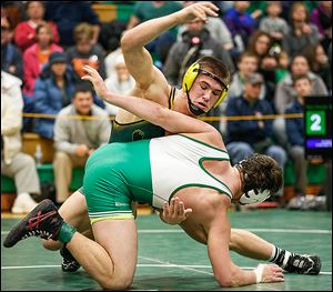 Clay's Matt Stencel, top, defeats Delta's Ryan Patchin 5-2 in the 182 pound championship match of the Maumee Bay Classic on Saturday in Oregon.