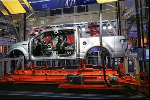 Ford’s 22-foot-high, 37.5-ton replica of an assembly line is designed to give a peek into how some of the automaker’s vehicles are manufactured.
