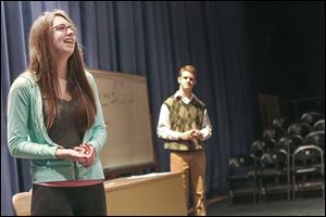 Sara Miller, 16, left, and Connor Treece, 16, rehearse ‘Thistle Blossoms,’ one of three Winter One Acts, before fellow theater students at Perrysburg High.