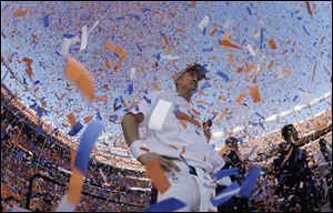 Broncos quarterback Peyton Manning is engulfed in confetti during the trophy ceremony Sunday in. The Broncos defeated the Patriots 26-16 to advance to the Super Bowl.