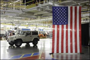 A Jeep Wrangler next to the assembly line at Chrysler Group's Toledo Assembly complex, in Toledo.