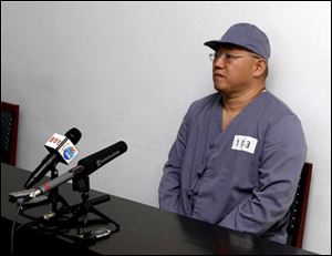 American missionary Kenneth Bae speaks to reporters at Pyongyang Friendship Hospital in Pyongyang Monday, Jan. 20. Bae, 45, who has been jailed in North Korea for more than a year.