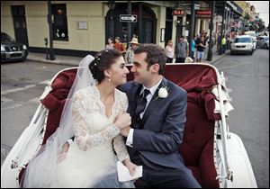Shannon and Justin Peach ride in a carriage after their wedding in New Orleans in October, 2013. Shannon's mom, Cheryl Winter, spent $500 for Hartford-based Travelers Insurance to cover her daughter’s destination wedding, where her biggest concern was a potential hurricane. The weather cooperated, but after the limousine failed to show they used the insurance policy to claim the deposit money they could not get back from the limo driver. 