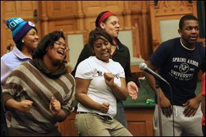 Bria Landry, 17, center, dances as the Toledo Youth Choir rehearses. A shared sound and common bond bring the 40 choir members a sense of belonging.