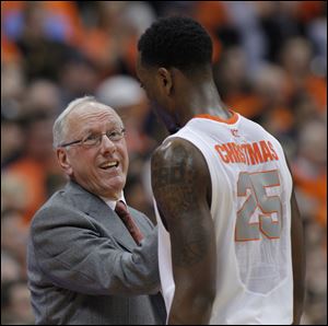 Syracuse’s head coach Jim Boeheim, left, talks with  Rakeem Christmas late in the second half of Saturday's game against Pittsburgh.
