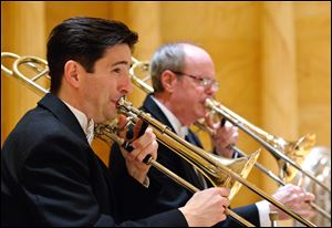 Garth Simmons, Toledo Symphony principal trombonist, will perform a selection from his newly released album, “American Visions,” with Michael Boyd, pianist, at the symphony’s Blade Chamber III Concert Sunday.
