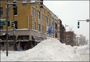 Snow is piled at Michigan and Madison after 13 inches fell on Jan. 5-6 on top of 9.4 inches on Jan. 1-2. The most recent snow pushed January’s total to 30.9 inches.