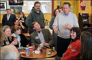 Gov. John Kasich speaks with supporters  in Findlay before he addressed the Wood County GOP’s Lincoln Day Dinner.