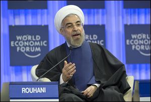 Iranian President Hassan Rouhani gestures as he speaks during a session of the World Economic Forum in Davos, Switzerland, 