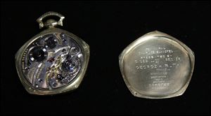 A the insides of a pocket watch that was given to Babe Ruth in 1923 is displayed at Heritage Auctions office in Dallas.