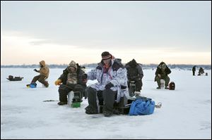 Anglers compete in the Midwest Open Ice Fishing Tournament at Devils Lake, Mich., last year. The event returns on Sunday.
