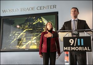 Alice Greenwald, director of the National Sept. 11 Memorial Museum, left, listens as Joseph Daniels, president of the National Sept. 11 Memorial, speak during a press conference on Friday in New York. 