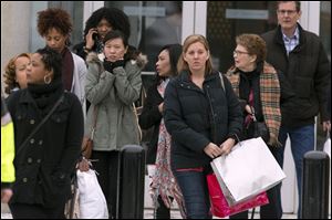 Shoppers are evacuated by police after a shooting at The Mall in Columbia on Saturday in Columbia, Md.