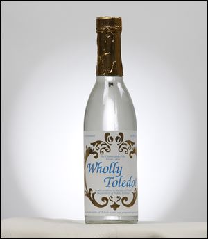 City officials had ‘Wholly Toledo’ drinking water bottled in the 1990s to distribute to visitors. Many bottles still remain in the mayor’s office.