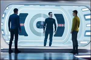Zachary Quinto, as Spock, Benedict Cumberbatch as John Harrison, and Chris Pine as Kirk, in a scene in the movie, 