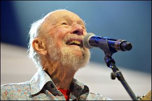 Pete Seeger performs on stage during the Farm Aid 2013 concert at Saratoga Performing Arts Center in Saratoga Springs, N.Y. in September.