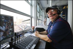 Toledo Mud Hens broadcaster Jim Weber does the play-by-play as the Hens play the Buffalo Bisons at Fifth Third Field last July.