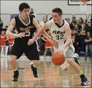 Lake’s Connor Bowen drives past Otsego’s Jerome Griffin. The 6-foot junior leads the team in scoring (19.8) and assists (9.1), and averages 5.5 rebounds. The Flyers are 13-0 overall, 7-0 in the Northern Buckeye Conference.