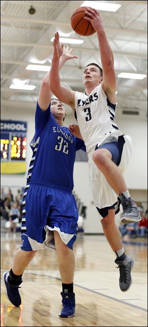 Lake junior Jared Rettig goes to the basket against Elmwood’s Trevor Solether. Rettig, a 6-foot-2 foward, averages 16.8 points and 8.5 rebounds.