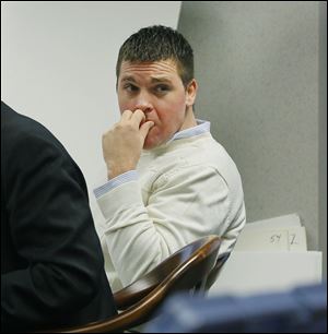 Defendant Cody Rickard looks back into the gallery during his trial at the Wood County Courthouse. Mr. Rickard is accused of aggravated vehicular homicide and aggravated vehicular assault resulting from an incident Oct. 28 at a construction site near Bradner, Ohio, where one CSX worker was killed and two others were injured.