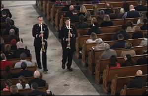 Firefighters celebrate mass and the lives of Toledo firefighters Stephen A. Machcinski and James Dickman at the Historic Church of St. Patrick in Toledo.  