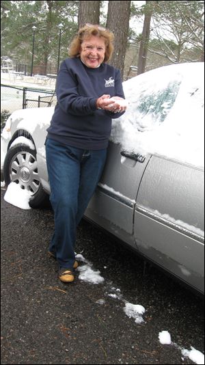 Mary Alice Powell and her snow-covered car in South Carolina. The storm caused chaos in parts of the South last week.
