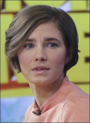Amanda Knox prepares to leave the set following a television interview on 'Good Morning America' today. 