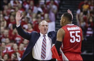 Ohio State coach Thad Matta talks with Trey McDonald during the first half of an NCAA college basketball game against Wisconsin.