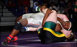 Central Catholic's Chris Green defeats Oregon Clay's Tyler Koester 6-1 in the 220 pound championship match during the Three Rivers Athletic Conference wrestling tournament finals.